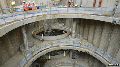 Britain"s Chancellor of the Exchequer George Osborne and the Chief Secretary to the Treasury Danny Alexander are given a a tour of a Crossrail construction site in central London