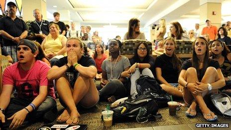 Penn State students watch the NCAA des liver sanctions against the university's celebrated football programme State College, Pennsylvania 23 July 2012