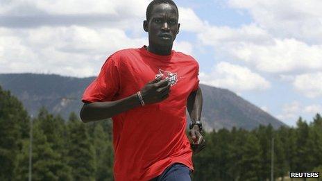 Guor Marial, 28, runs along a street in Flagstaff, Arizona, on 21 July 2012