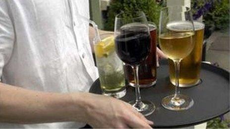 Waiter with tray of drinks