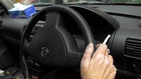 Man smoking in car