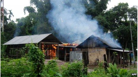 A house burns at Kachugaon village in Kokrajhar district, about 230 kms from Guwahati, the capital city of the northeastern state of Assam during violent clashes on July 23, 2012