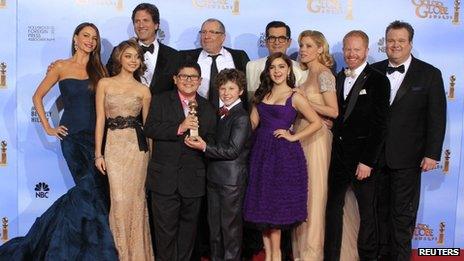 The cast of Modern Family pose with their Golden Globe in January 2012