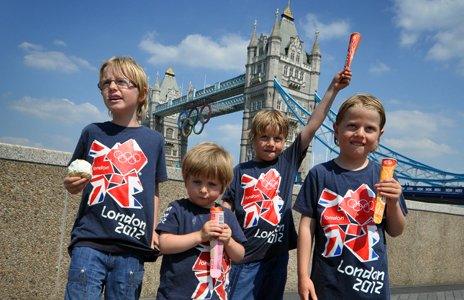 Boys wearing London 2012 t-shirts near tower bridge