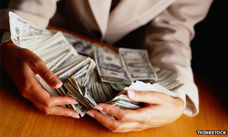 Woman's hands holding money