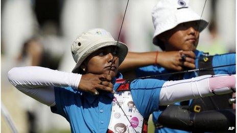 India"s Deepika Kumari, left, Tarundeep Rai aim for their targets during training at the 2012 Summer Olympics, Wednesday, July 25, 2012, in London