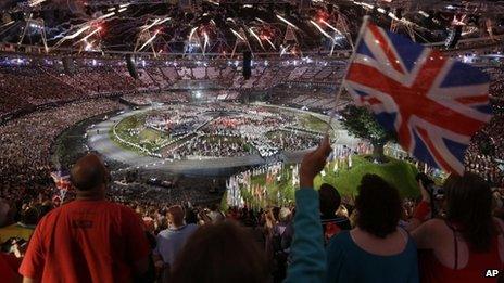 Spectators watch the London 2012 Opening Ceremony at the Olympic Stadium