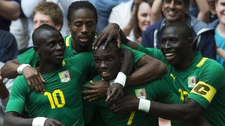 Senegal's Moussa Konate is congratulated by his teammates