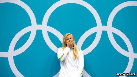 A shocked Ruta Meilutyte waits to receive her gold medal