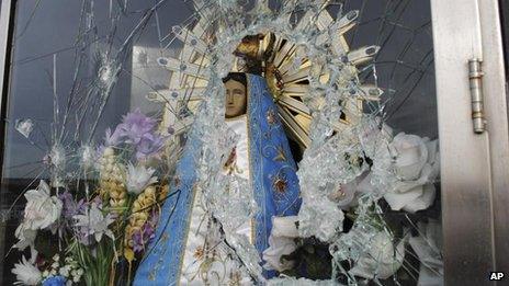 Image of Virgin Mary behind shattered glass near Darwin in the Falklands (Picture released by Commission of Families of Fallen soldiers 30 Jul 2012)