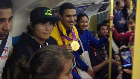 Ruben Limardo Gascon shows off his gold medal on the tube