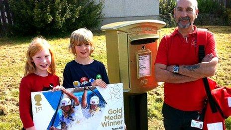 Gold post box and stamp