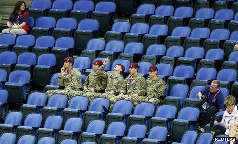 Soldiers fill empty seats at the gymnastics