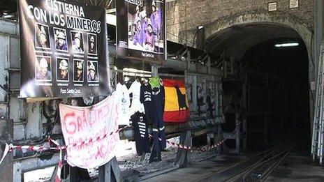 Protest posters outside a mine in Santa Cruz del Sil, in the Spanish region of Asturias