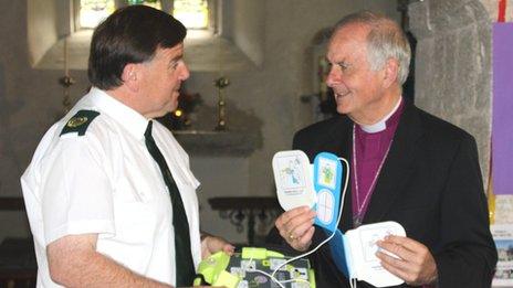 The Archbishop of Wales, Barry Morgan, with Welsh Ambulance Service national Pads manager Gerard Rothwell