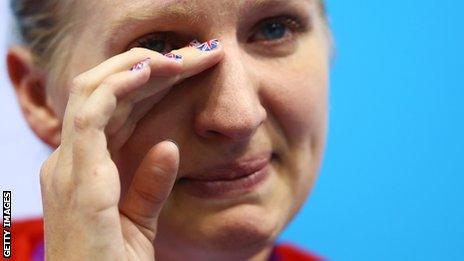 Becky Adlington sheds a tear as she prepares to collect her bronze in the 800m freestyle