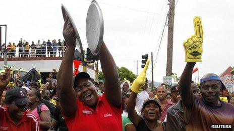 Jamaicans celebrate at the Half Way Tree in Kingston - 5 August