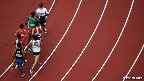 Competitors running anti-clockwise