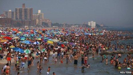 Crowds on the beach at Coney Island, New York 30 June 2012