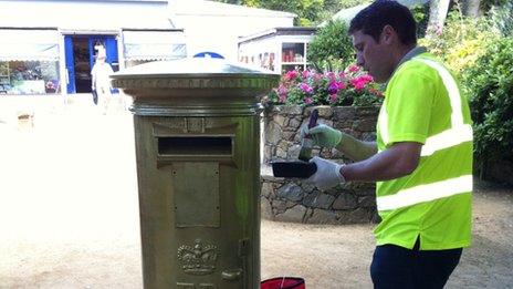 Sark's only post box being painted gold to mark Carl Hester's Olympic success in Team GB's dressage