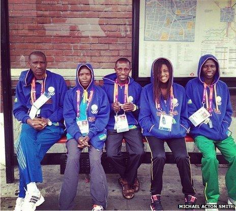 Team Rwanda members waiting for a bus