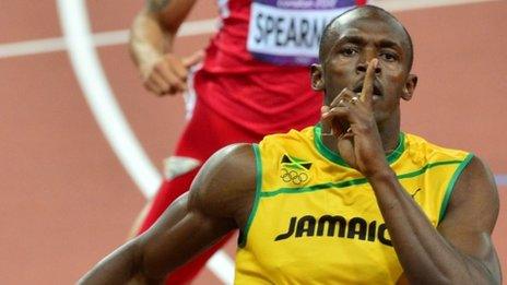 Usain Bolt celebrates victory in the 200m