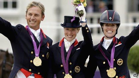 Carl Hester, Laura Bechtolsheimer and Charlotte Dujardin celebrating winning team gold at the London 2012 Olympics