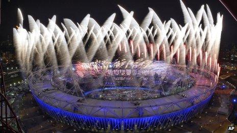 The outside of the main stadium during the fireworks at the end of the opening ceremony