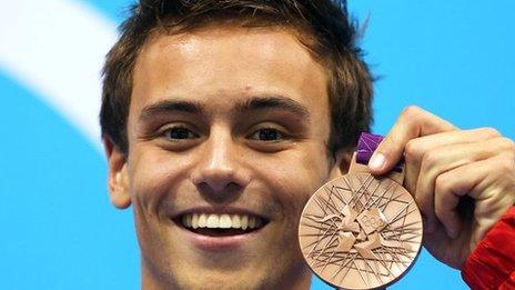 Tom Daley celebrates winning a bronze diving medal at London 2012