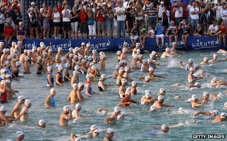 Iron man contestants swim in Klagenfurt am Woerthersee