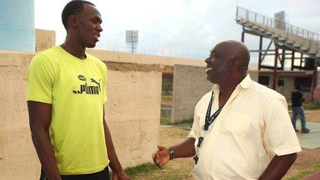 Usain Bolt with coach Glen Mills