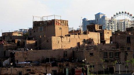 Houses in Kashgar's old city with the new apartment blocks in the background