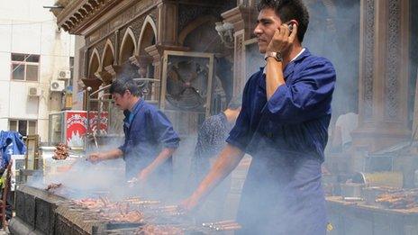 A barbecue snack hawker on the street in Kashgar