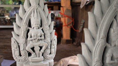 A restored sculpture at a workshop in Angkor