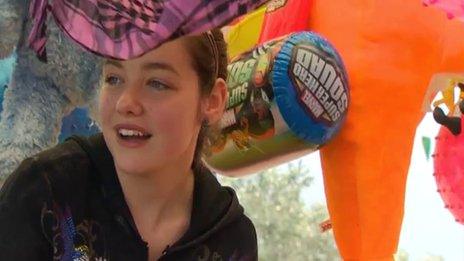 Shelby Holmes working at her parents' amusement arcade in Towyn