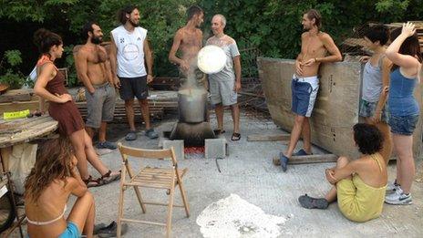 Members of the Evia community making a meal