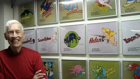 Don Allen in his Ohio basement with reproductions of his nose art images