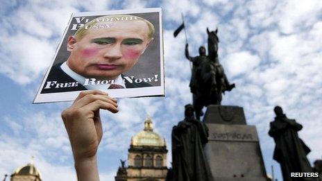 Demonstrator holding up placard protesting against the jailing of three members of Russian opposition punk group Pussy Riot in Moscow earlier on 17 August 2012