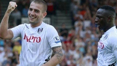 Mladen Petric (left) celebrates scoring for Fulham on his debut