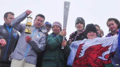 LOCOG chairman Lord Coe with the Scouts on the summit of Snowdon