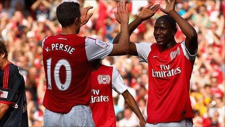 Robin van Persie and Benik Afobe celebrate a goal for Arsenal