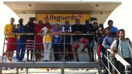 The international delegates with the RNLI lifeguards at Sandbanks