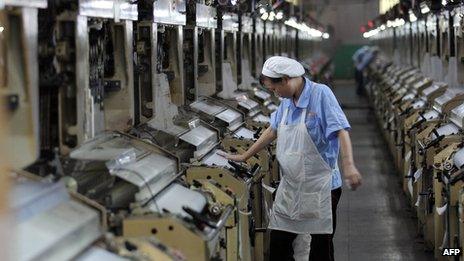 File photo: A Chinese worker at a thread factory in Fujian province