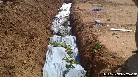 Photo reported to show a mass grave in Darayya