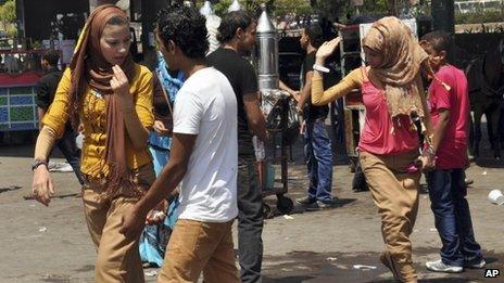 Egyptian women are harassed by men and boys in Cairo. Photo: August 2012