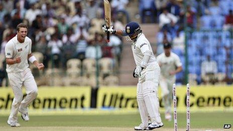 India"s batsman Sachin Tendulkar reacts after he is bowled out by New Zealand bowler Tim Southee, left, during the fourth day of their second cricket test match in Bangalore, India, Monday, Sept. 3, 2012