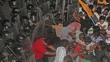 Supporters of former Maldivian President Mohamed Nasheed clash with soldiers during a protest in Male on 1 September