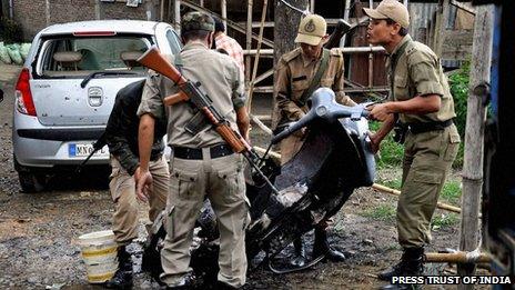 Policemen at the site of the blast in Imphal