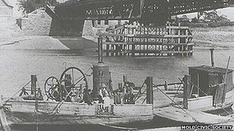 1890: A ferry beneath the bridge at Queensferry