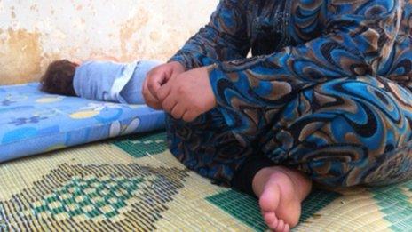 A displaced Syrian woman child in Damascus